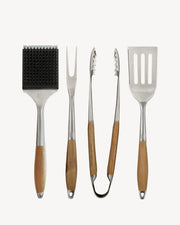 Quattro utensili in acciaio inox e bambù