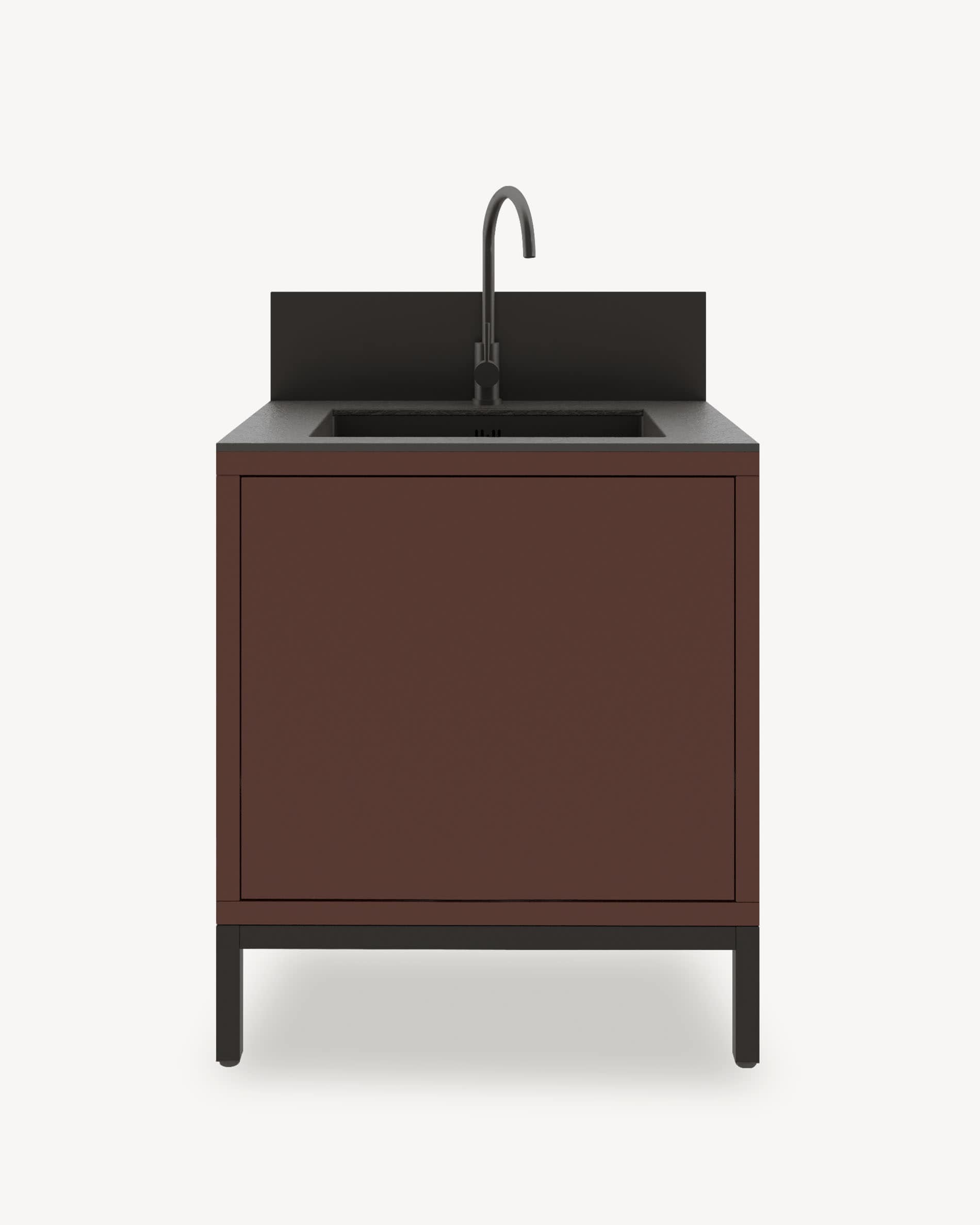 Modulo cucina su pilotis con lavello integrato, mobile color ruggine con vano chiuso, piano di lavoro scuro e alzatina integrata.